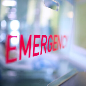 A reflective surface labelled 'Emergency'