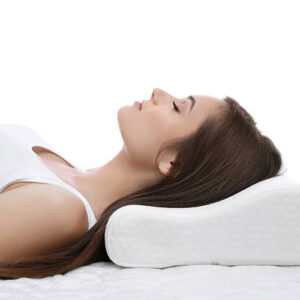 Woman sleeping peacefully laying on her back with her head on a contoured pillow