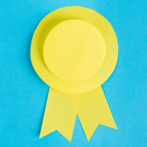 A photo of a yellow paper ribbon