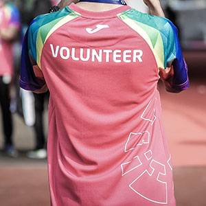 A photo of the back of a person wearing a shirt that says "Volunteer."